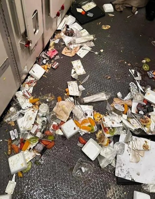 Food, drinks and cutlery were strewn across the galley kitchen of the aircraft