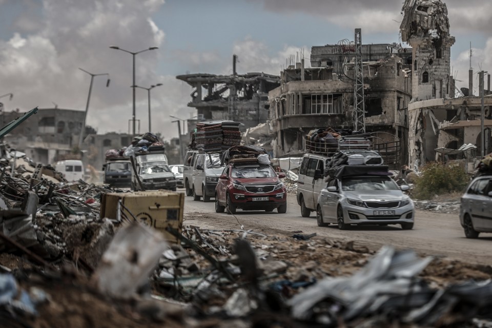 Hundreds of Palestinians were seen leaving Rafah in the early hours of this morning as they drove past the battered remains of the city