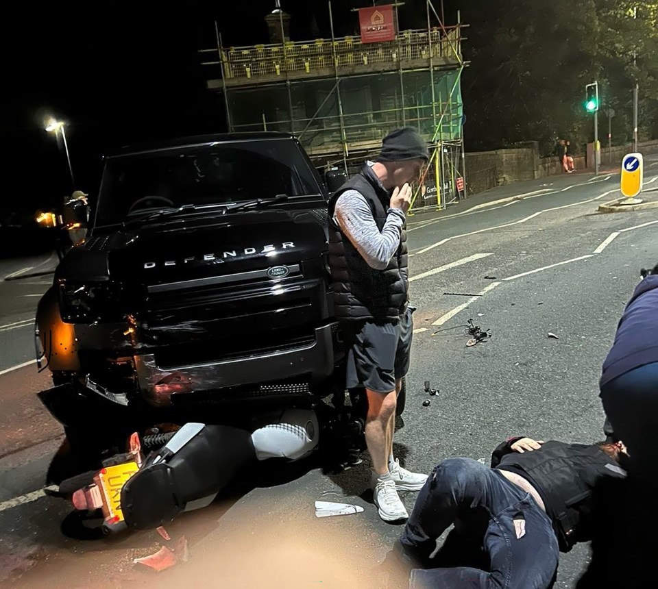 Nicky Butt puts his hand to his mouth as biker Adam Fielding lies injured in road