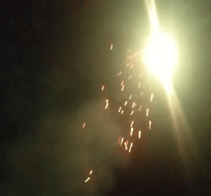 Fireworks shoot up into the night sky