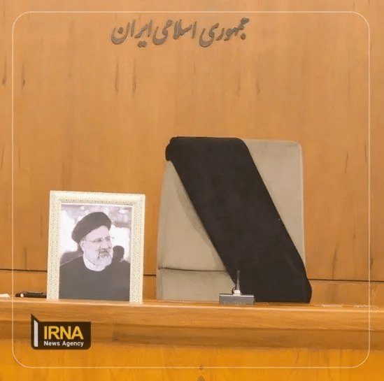 The chair where President Raisi sat during government meetings is wrapped with black cloth during an urgent meeting on Monday