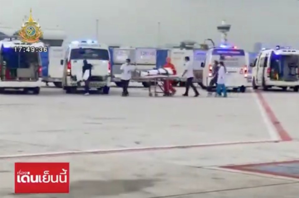 Chilling footage showed people being wheeled out of the cabin on stretchers and in wheelchairs