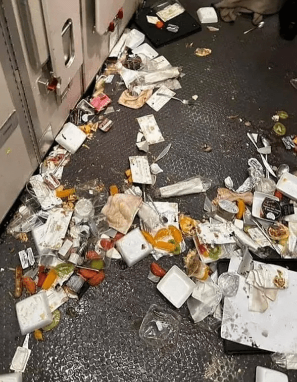 Passengers' unfinished meals are seen strewn across the galley kitchen of the plane