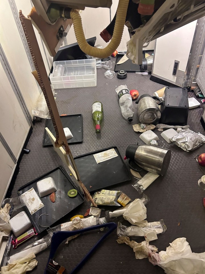 Food, drinks and cutlery were strewn across the galley kitchen of the aircraft