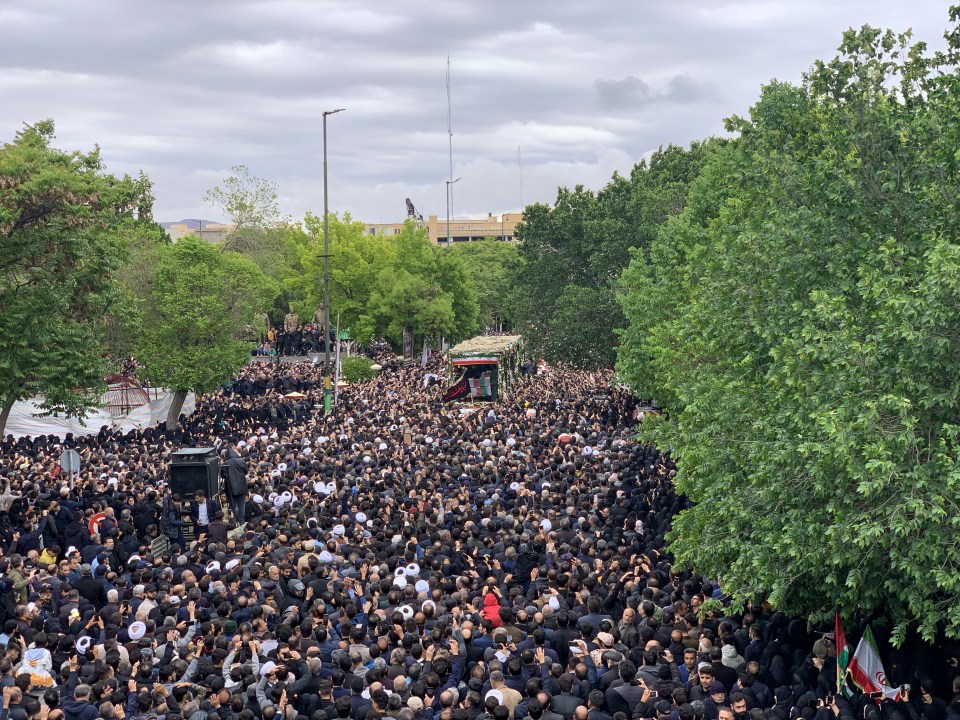 Thousands of mourners attend the first day of a three-day funeral for Raisi