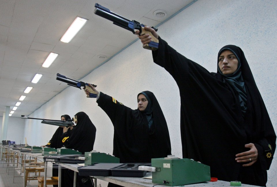 Iranian female police officers shoot during target practice