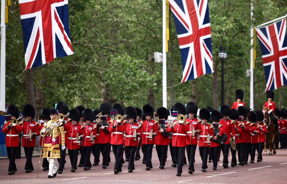 Irish Guards, a regiment of the Household Division Foot Guards, parade down The Mall