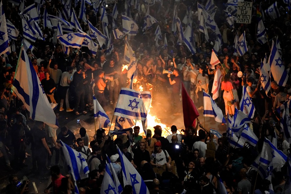 Israelis opposed to PM Benjamin Netanyahu’s judicial overhaul plan set up bonfires and block a highway during a protest