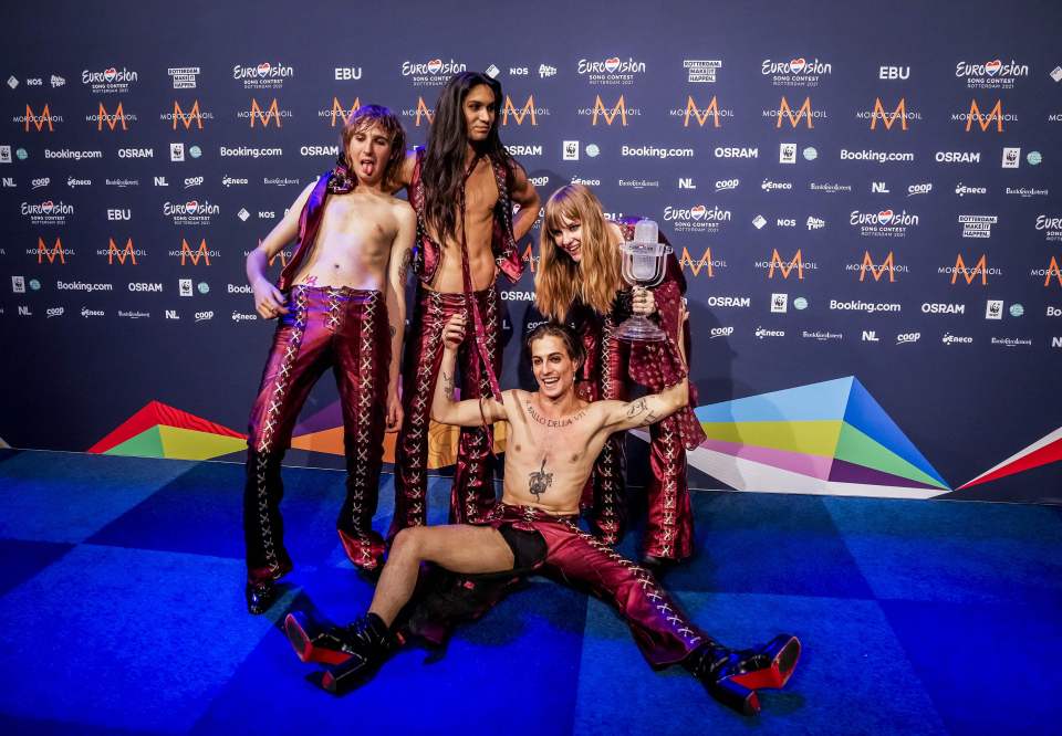 Italy’s Maneskin poses with their trophy at the end of a press conference