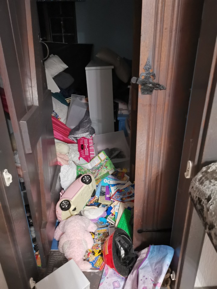 EXCL Katie Prices mucky mansion still has scorched walls from house fire a YEAR ago as new pictures show piles of dirty clothes and litter.