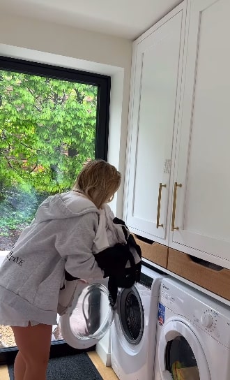 Saffron’s dirty laundry ends up in a cupboard above her washing machine