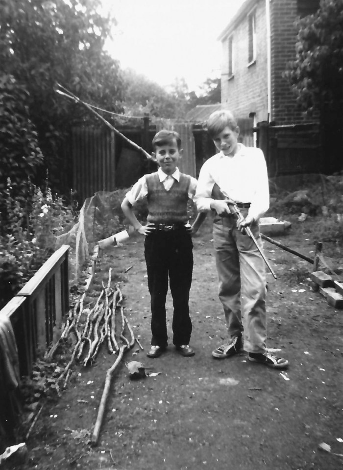 Young Ronnie as a child (right) holding a gun