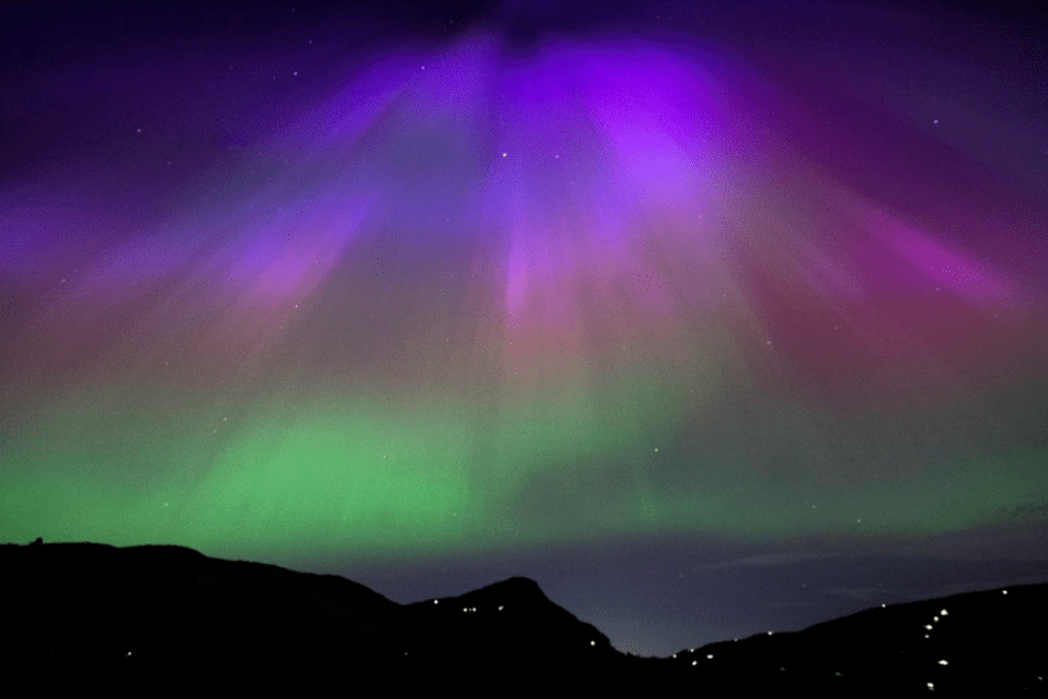 The aurora borealis is seen above Arthur’s Seat, Edinburgh, on Friday May 10