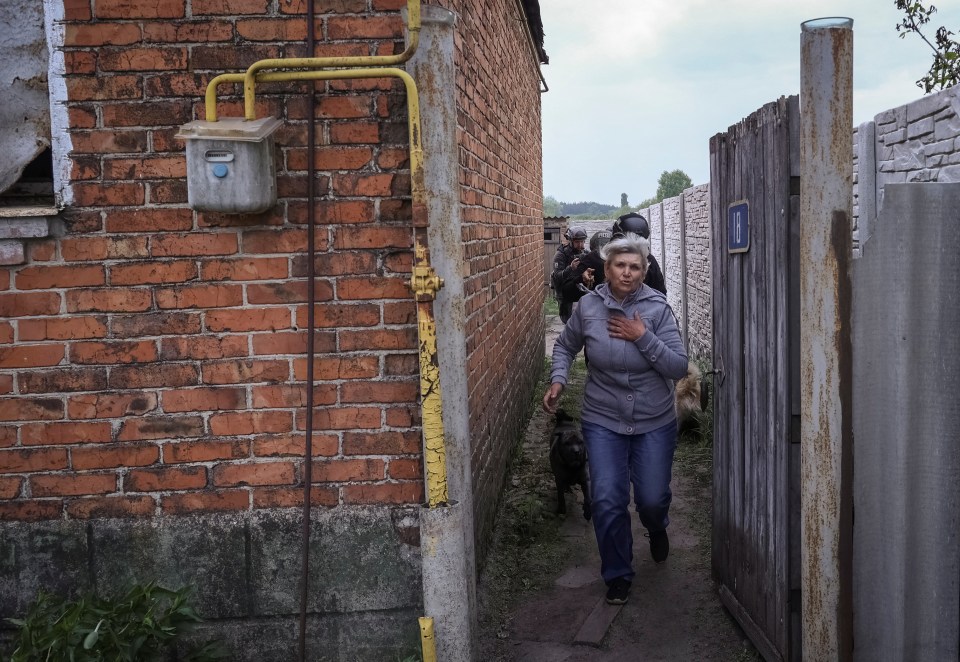 A local resident evacuates the town of Vovchansk in Kharkiv on May 14