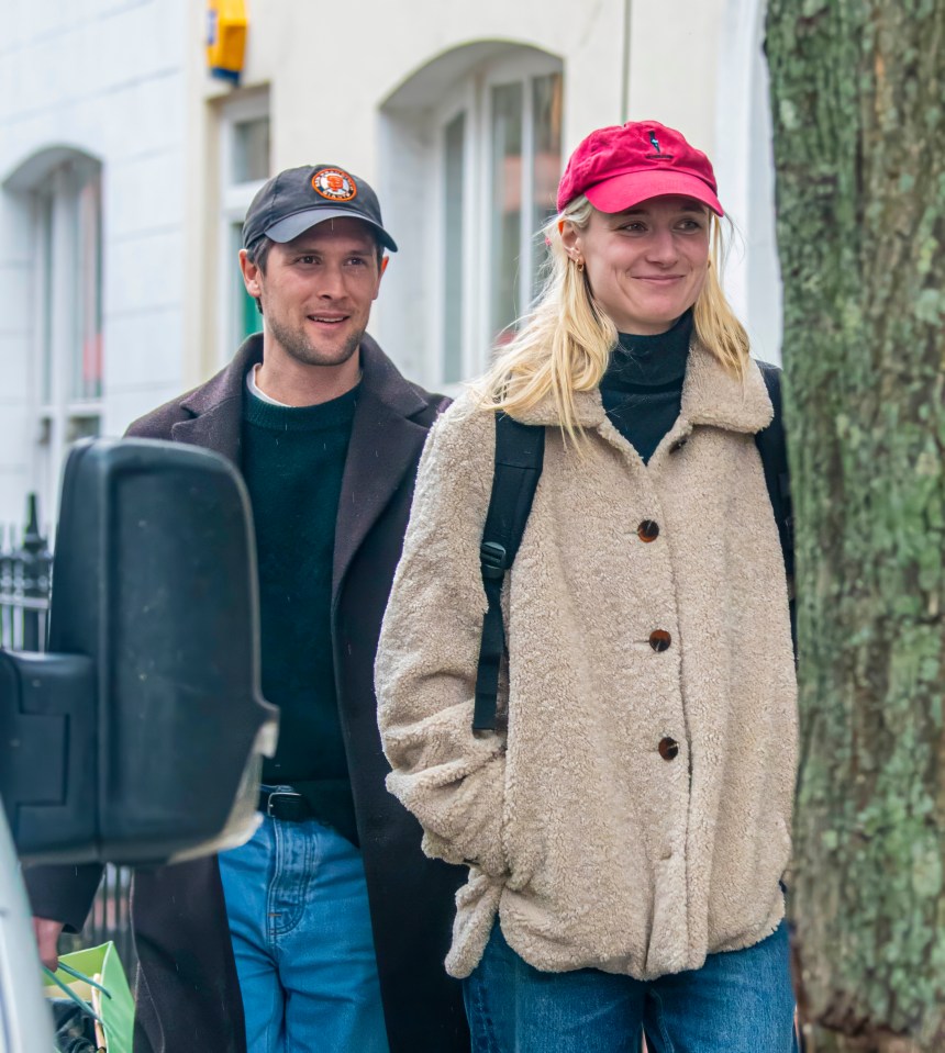 Elizabeth strolling round London with partner Kristian Rasmussen in March