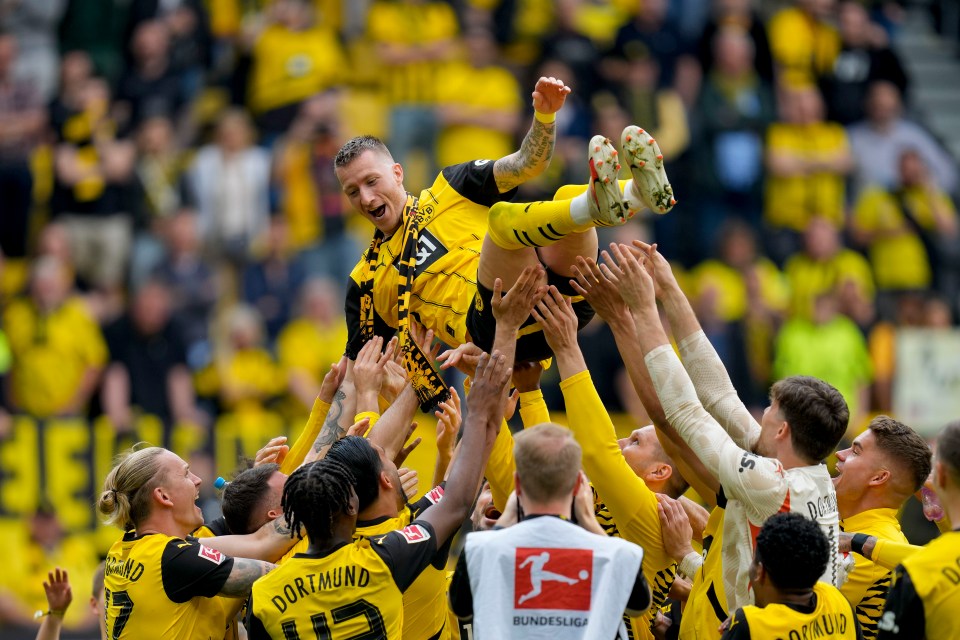 Reus was held aloft by his team-mates at full-time