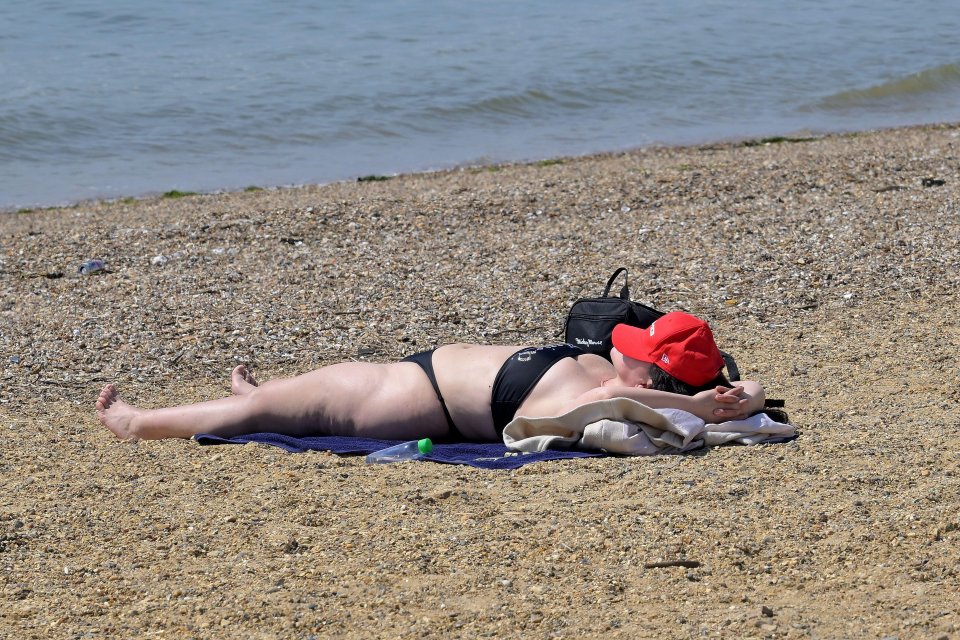 A woman sunbathing in Southend, Essex