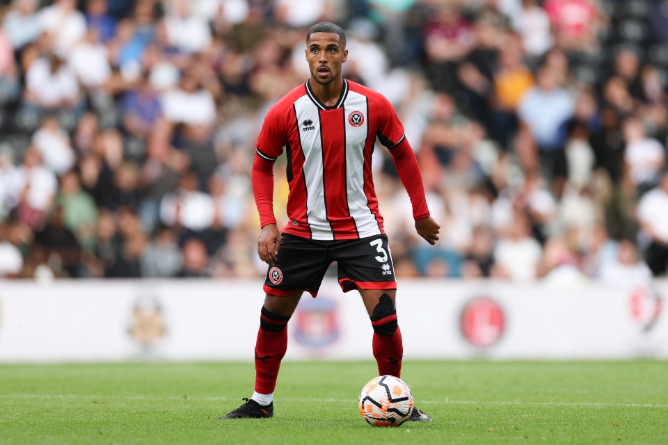 a soccer player with the number 3 on his jersey