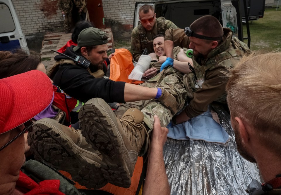 A wounded Ukrainian soldier following Russia's latest attack in the Kharkhiv region