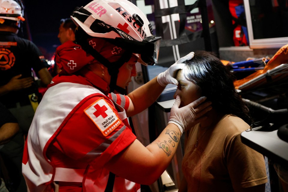 A wounded woman receives treatment