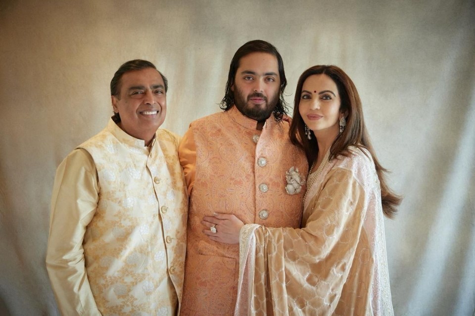 Mukesh Ambani (left) his wife Nita Ambani and their son Anant Ambani pose during the pre-wedding celebrations