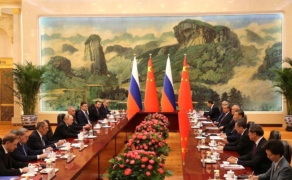 Putin, second left, and Chinese President Xi Jinping, third right, attend the talks in Beijing