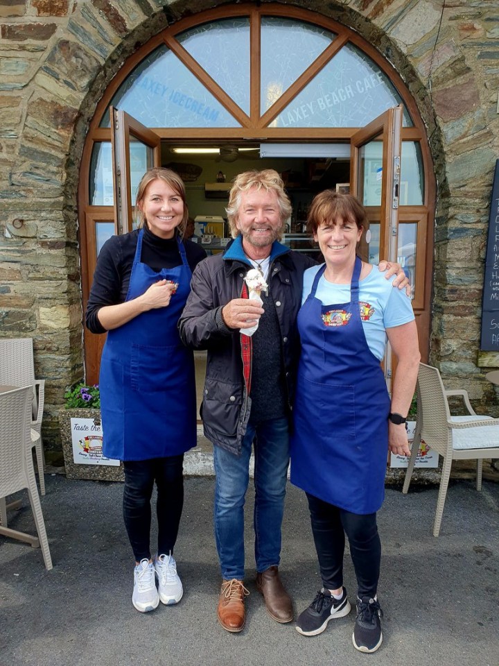 Noel Edmond tucked into a delicious ice cream at a seaside town – but fans were more interest in a bizarre detail they spotted