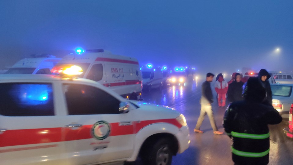 Rescue vehicles are battling through thick fog and heavy rain