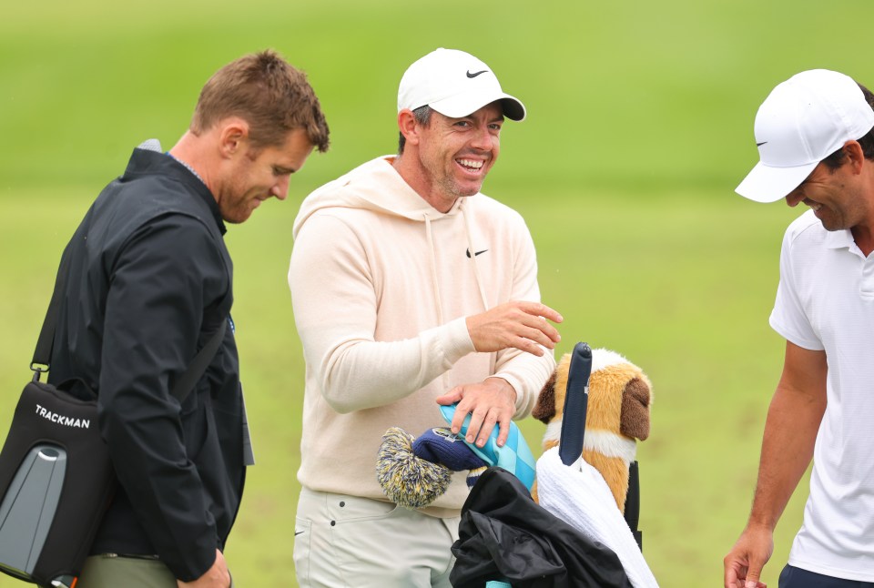 The four-time major winner laughed with his caddy on course