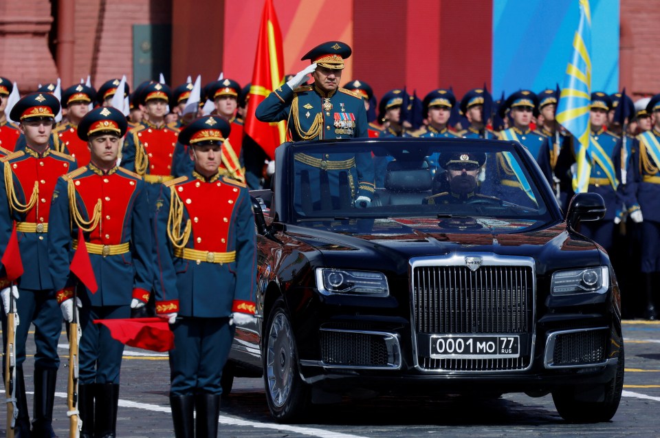 Russian Defence Minister Sergei Shoigu salutes to soldiers