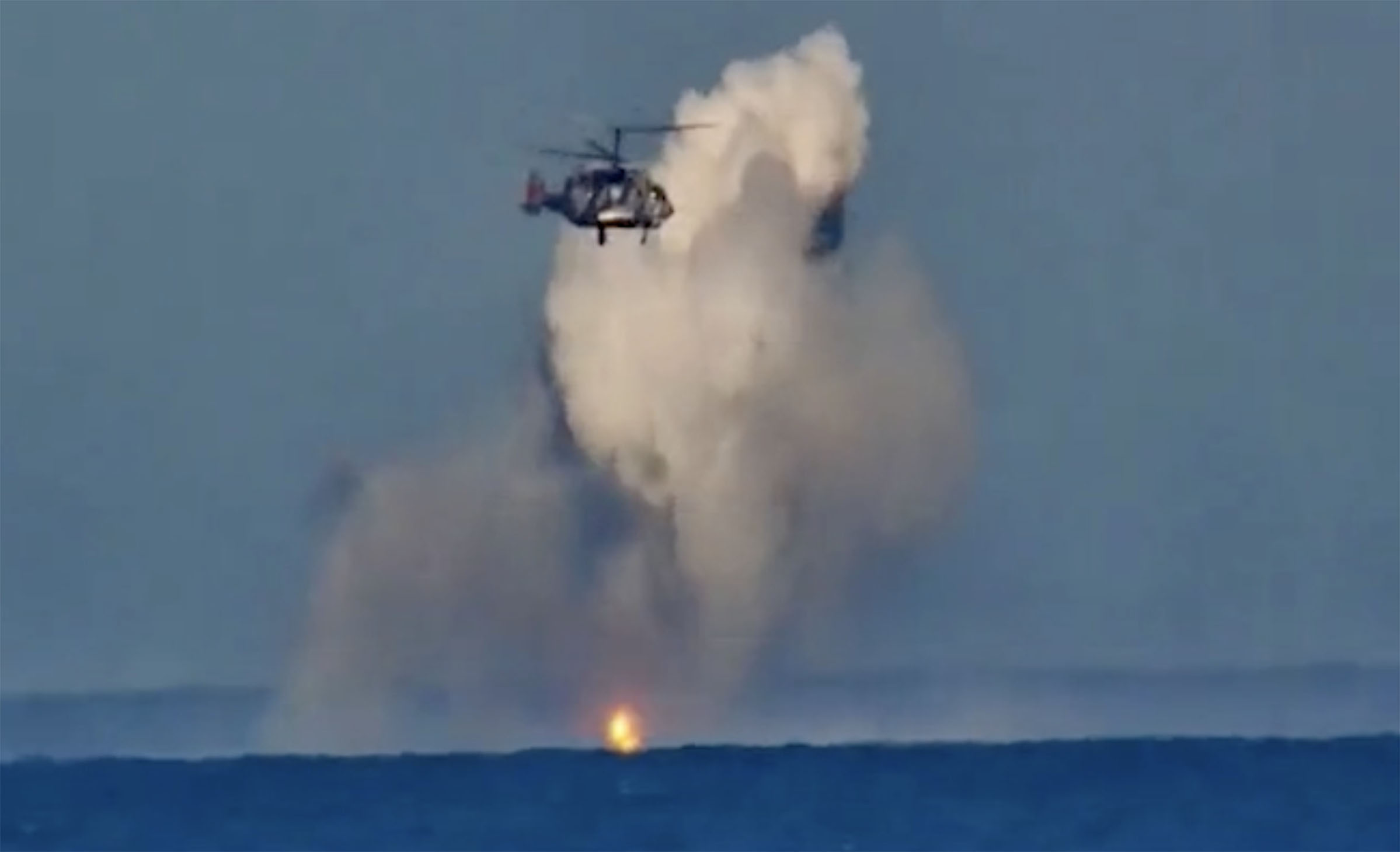 A huge explosion fills the sky as the chopper appears to finally have hit the drone