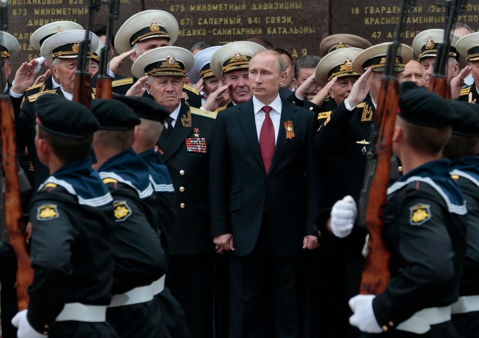 Vladimir Putin attends a parade marking Victory Day in Sevastopol, Crimea on May 9, 2014