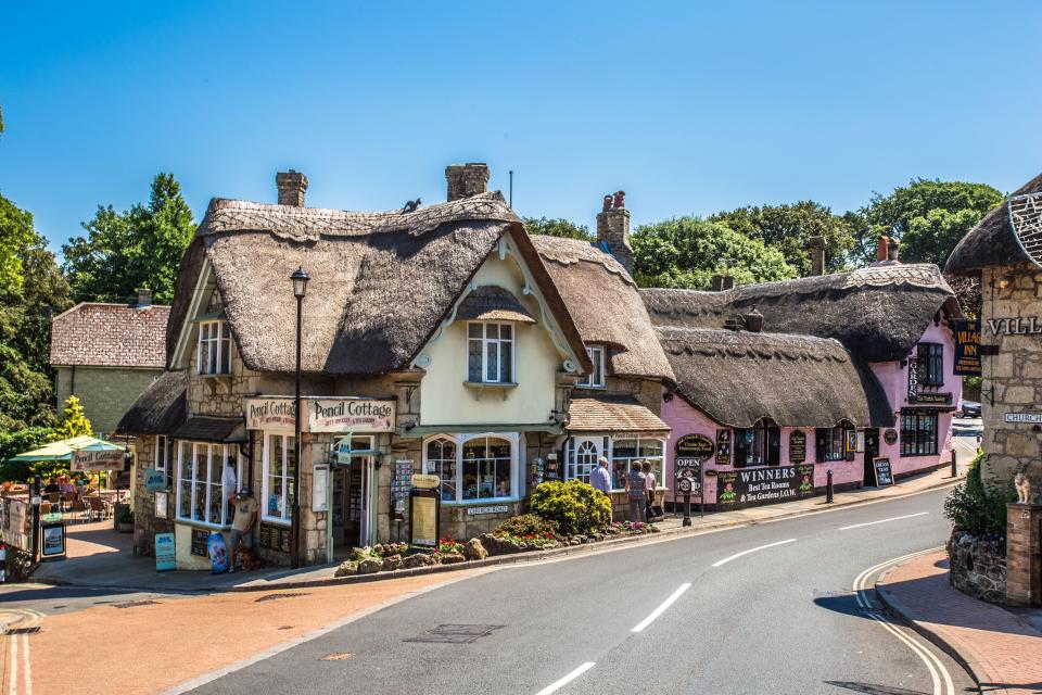 Tourists love exploring the town's thatched cottages