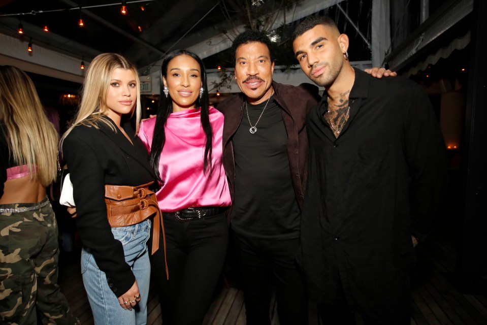 Miles is pictured with his dad Lionel, sister Sofia and stepmum Lisa Parigi