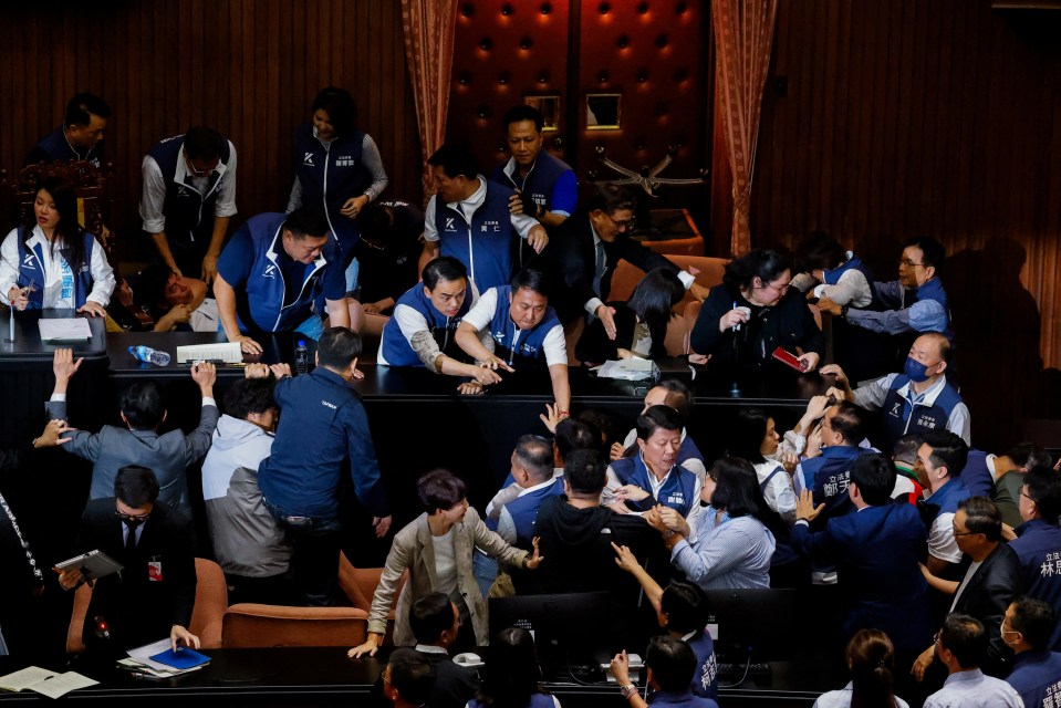 Taiwan lawmakers argue and exchange blows during a parliamentary session in Taipei