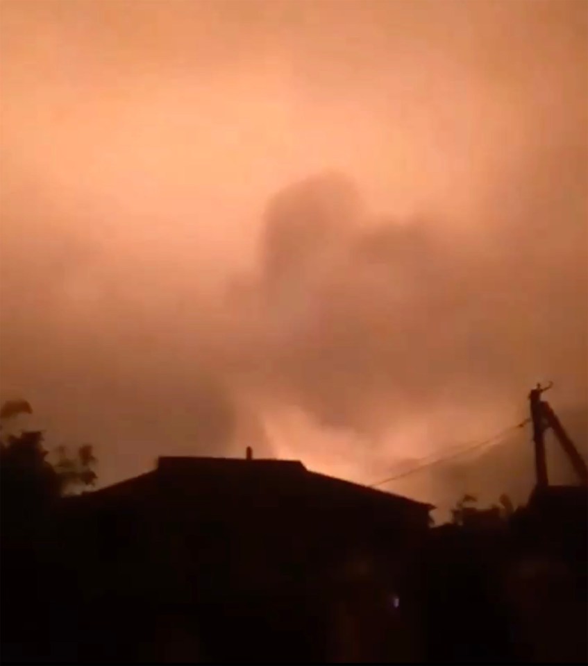 Smoke rises from behind a building close to the Crimean Bridge