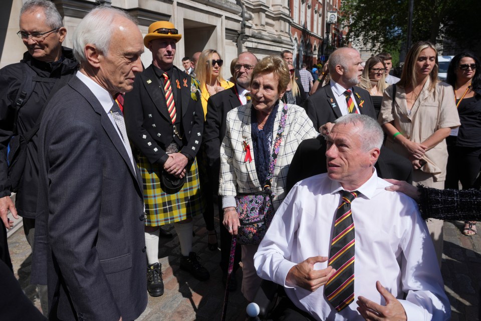 Inquiry chair Sir Brian Langstaff (left) with campaigners and victims