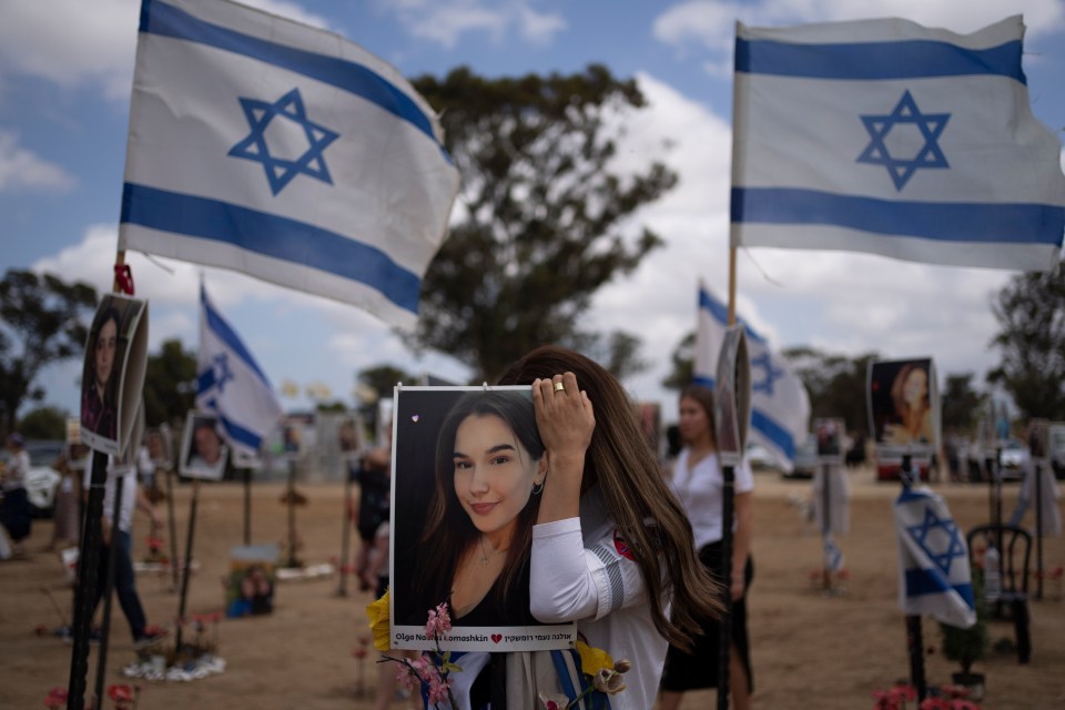 Relatives of revellers killed and kidnapped on October 7 attend Israel’s annual Memorial Day for fallen soldiers at the Nova music festival site