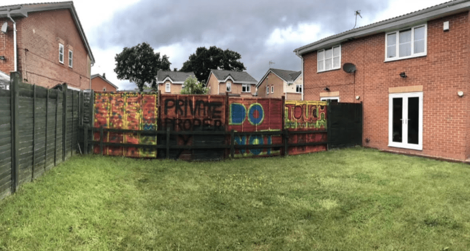 She graffitied her own fence with 'do not touch - private property'