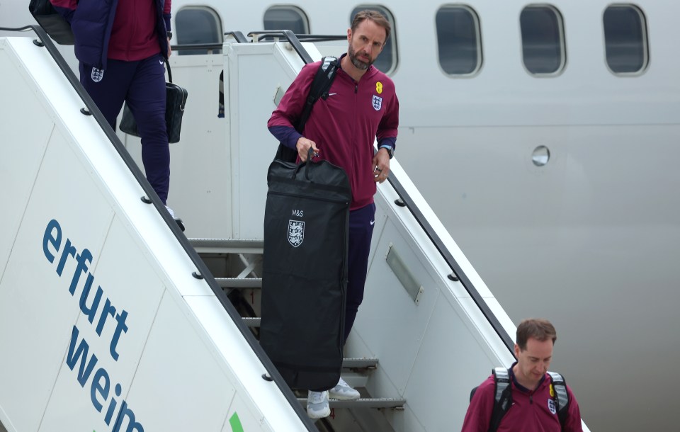 Gareth Southgate walked down the steps after arriving in Germany