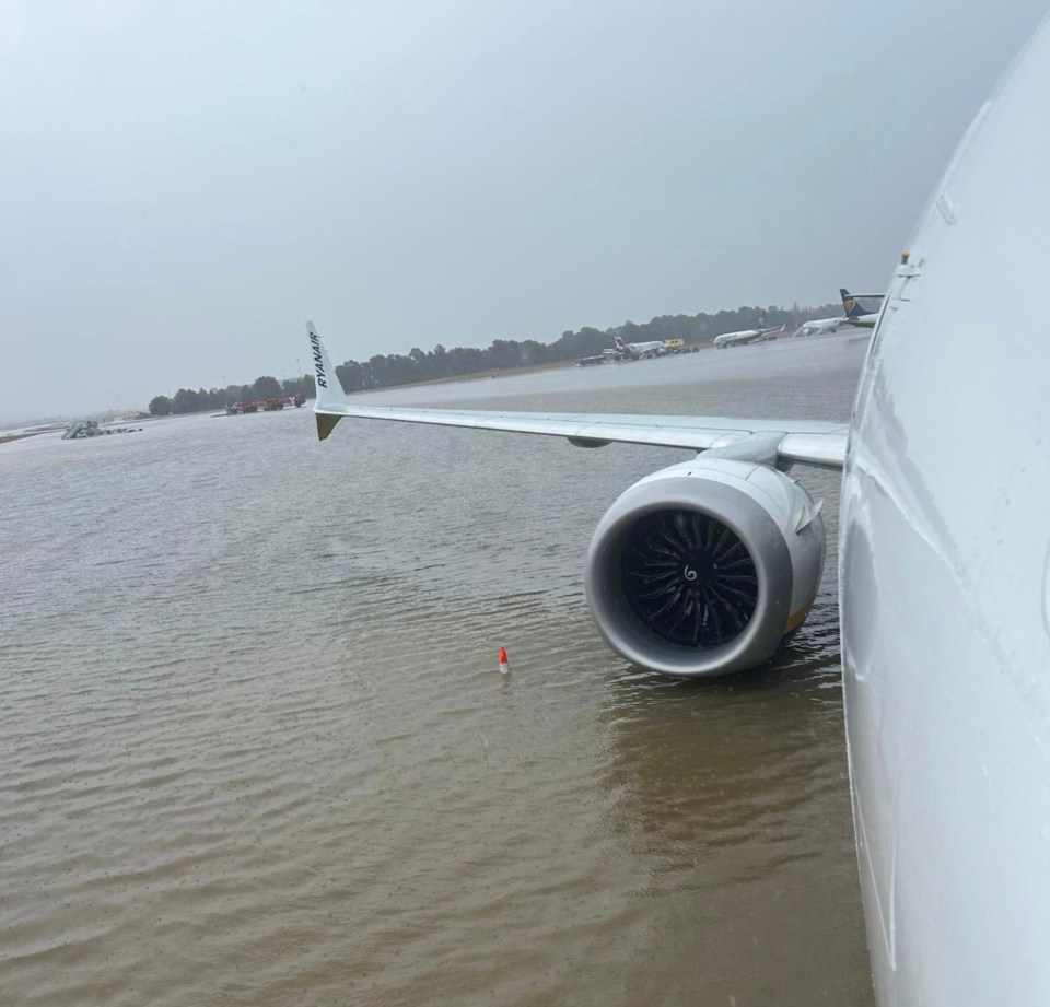 Images show planes being stuck on flooded runways at Palma de Mallorca Airport