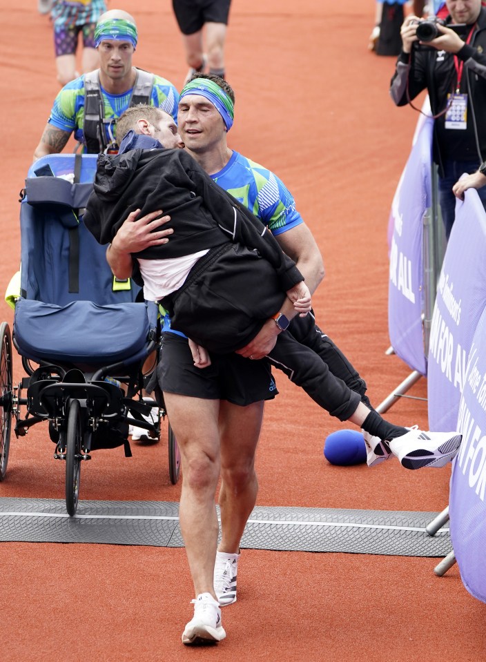 Rob and teammate Kevin Sinfield crossing the finish line at the Leeds Marathon