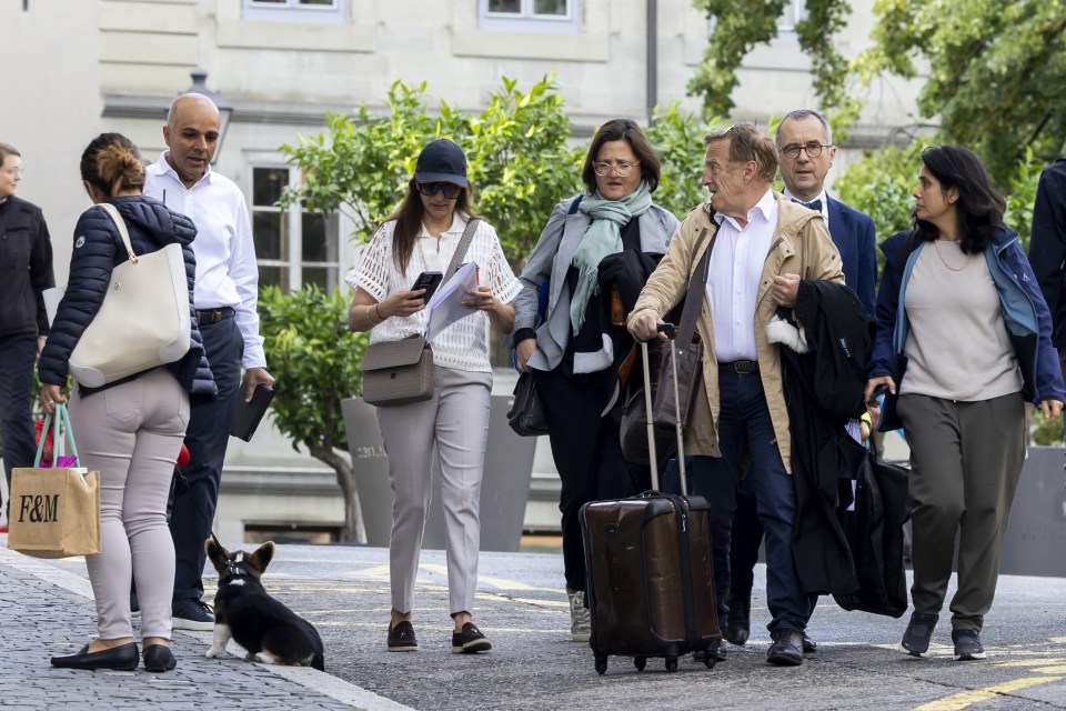 Lawyers Yael Hayat (centre-right), Robert Assael (3-R), and Nicolas Jeandin (2-R) arrive at the court house with their clients Ajay Hinduja (2-L) and his wife Namrata (C-L), June 10