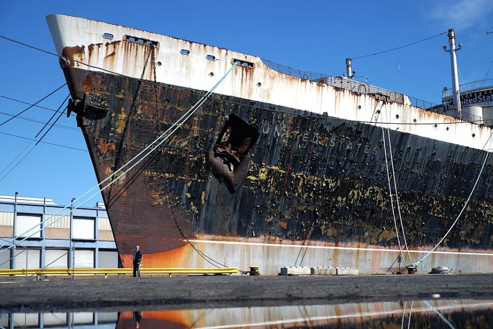 a rusty ship with the word united states on it