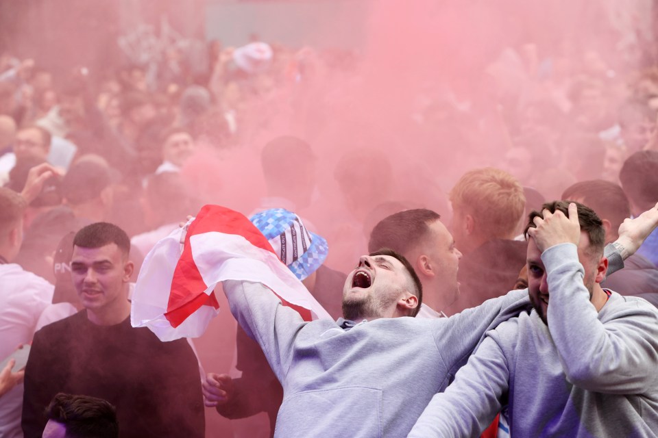 a man holding a flag that says ' england ' on it