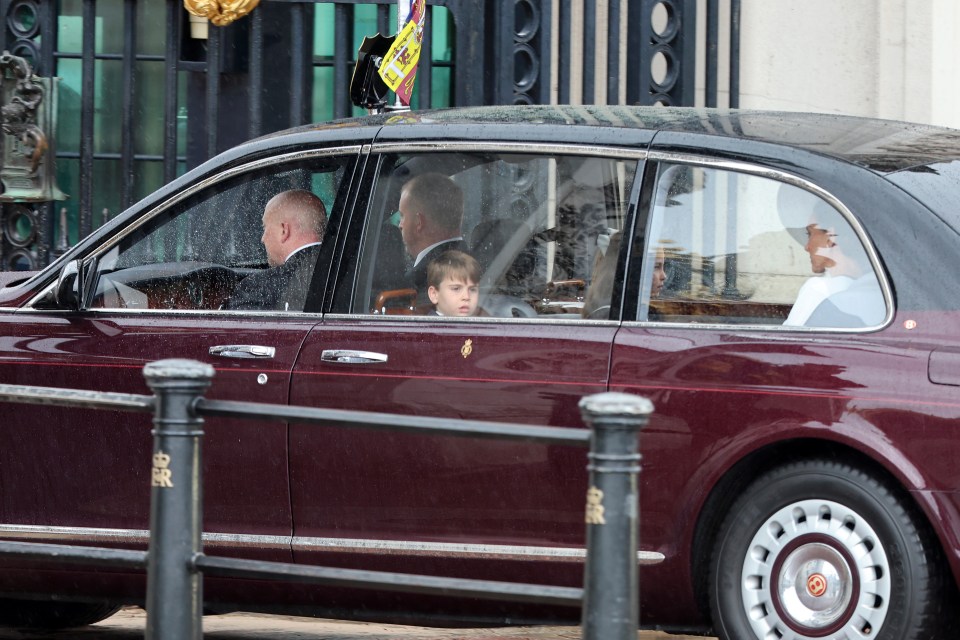 Prince Louis was snapped peeking out the window of the car