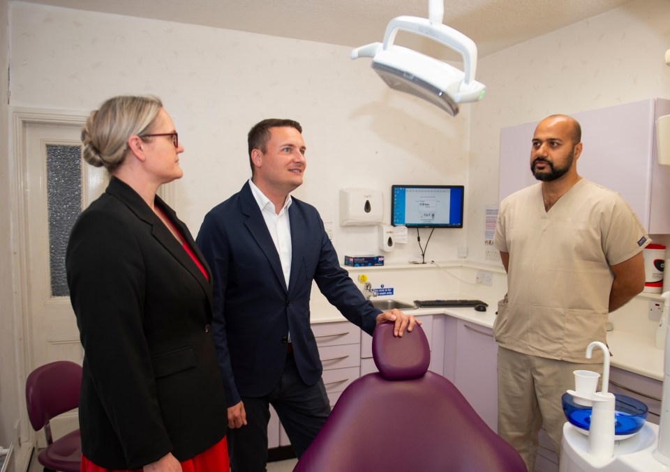 Wes Streeting and Lizzi Collinge talk with a dentist in Morecambe