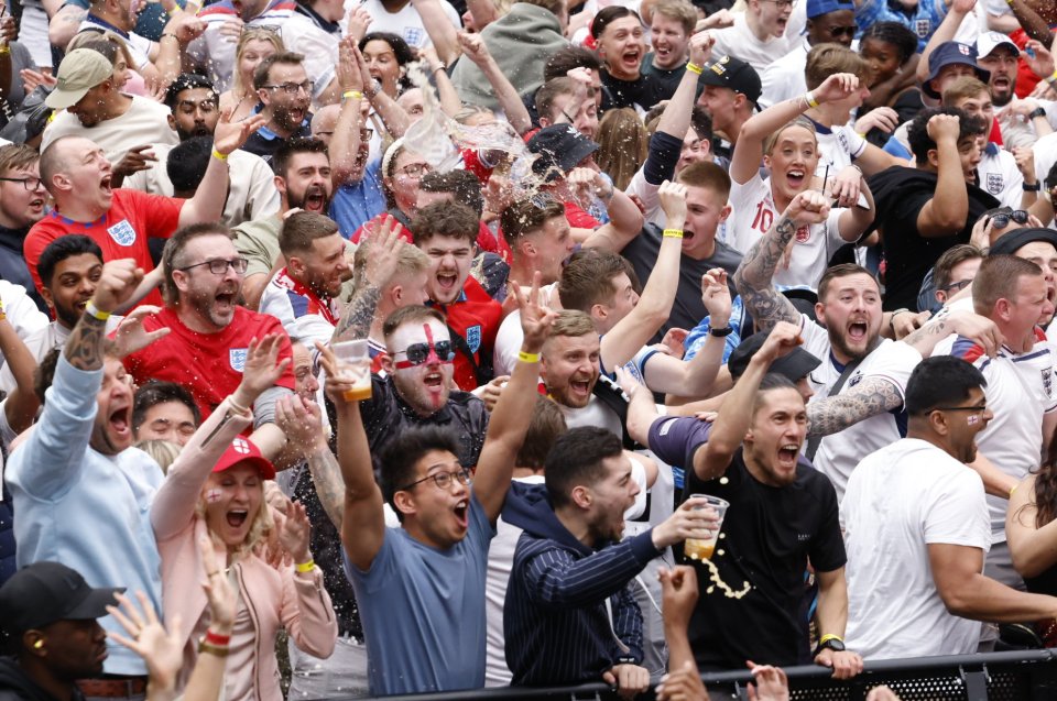 a crowd of people with one wearing a shirt with the number 10 on it