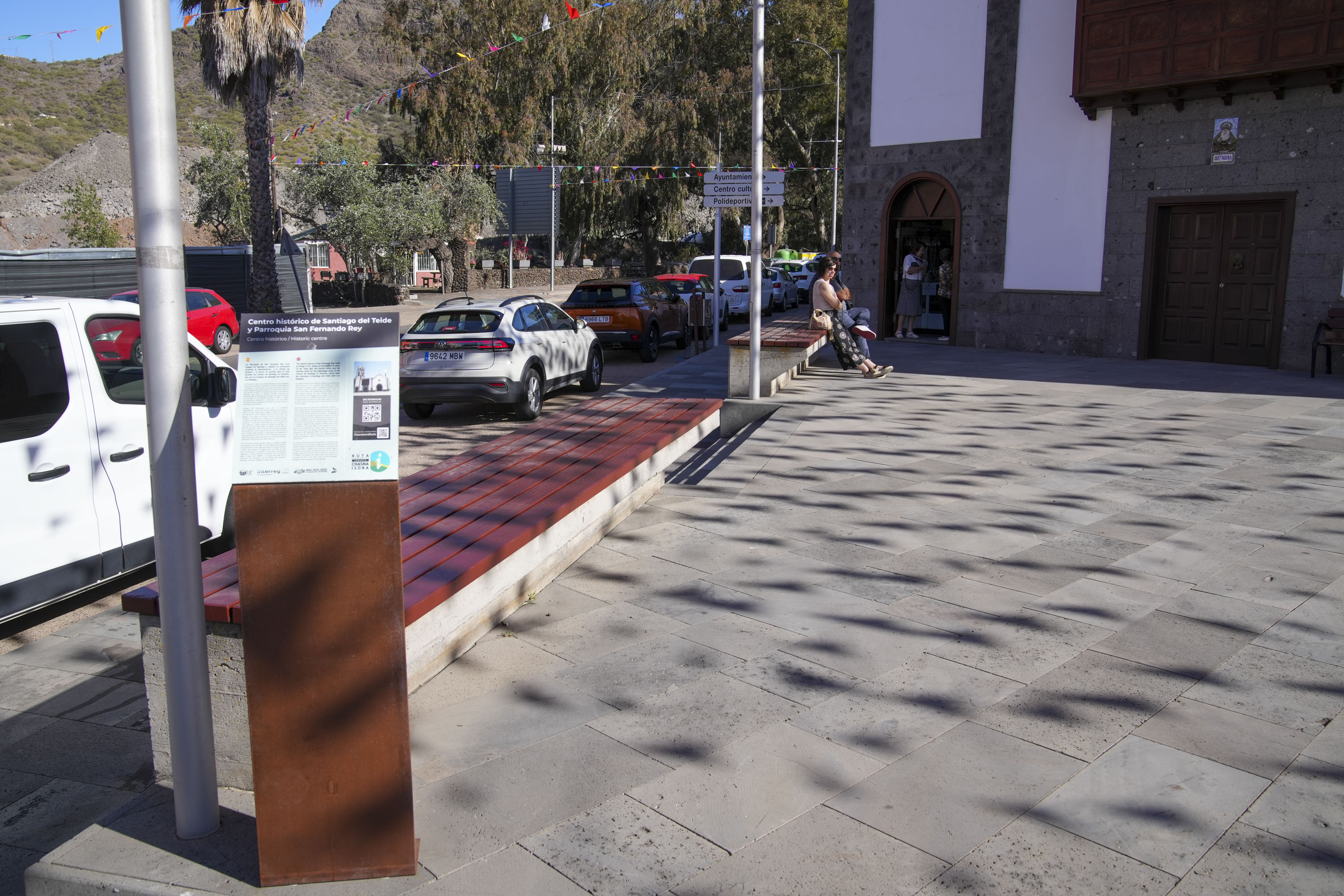 The British teen supposedly sat on this bench near the church with two men