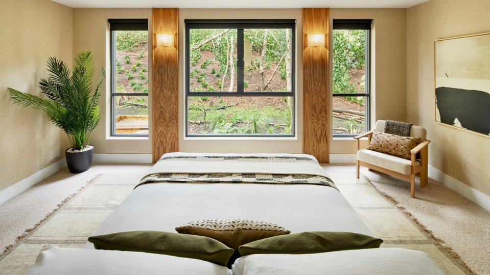 The dad-of-three's new main bedroom suite has a central headboard